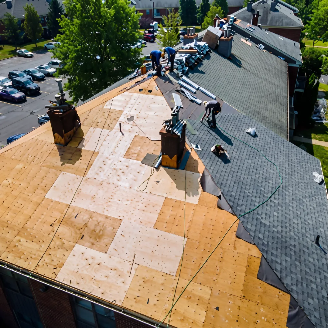 Roofer installing durable shingles