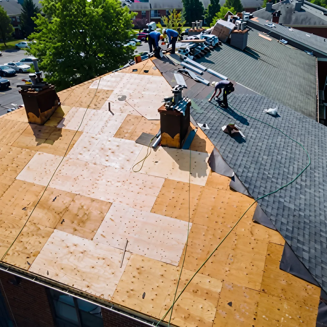 Roofer installing a durable shingle roof