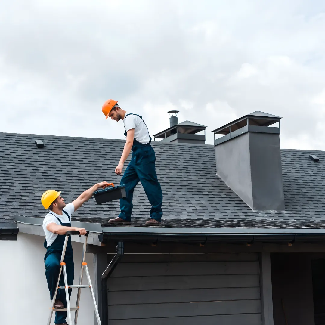 Roofing crew installing storm-resistant shingles