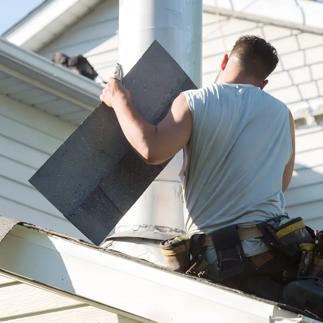 Roofing professional checking flashing for leaks