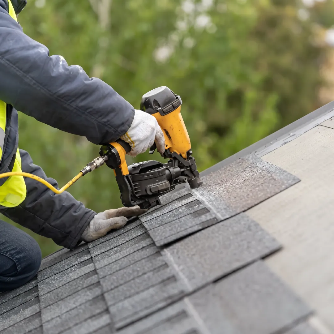 Installer inspecting a residential roof