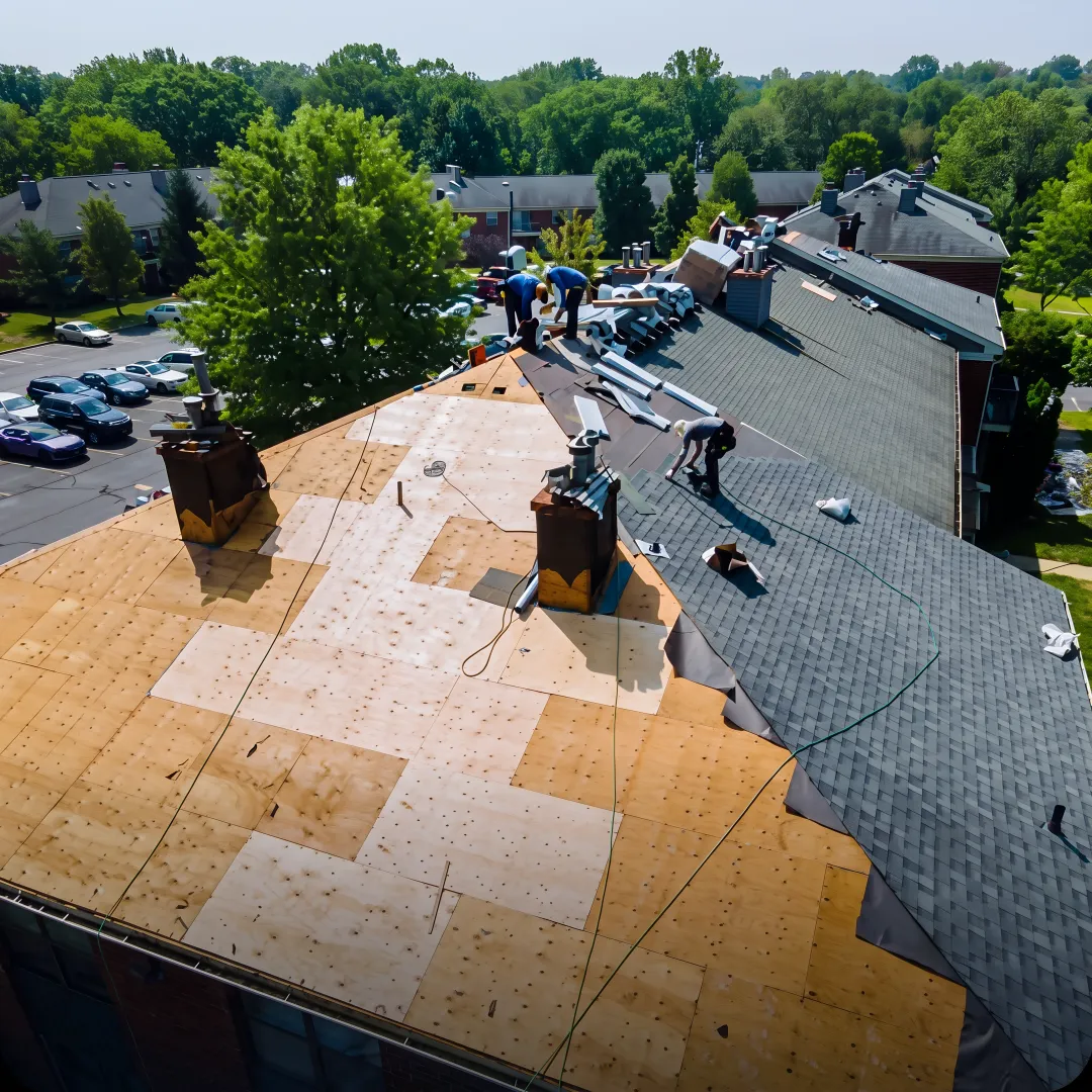 Installer preparing a roof for replacement