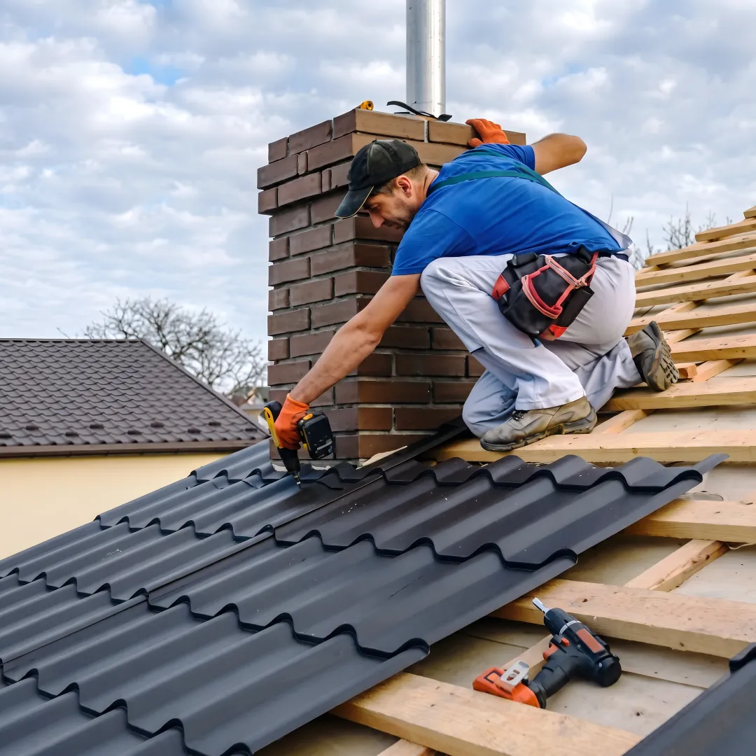 Roofing professionals installing metal panels