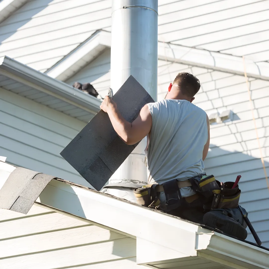 Technician assessing a clean residential roof