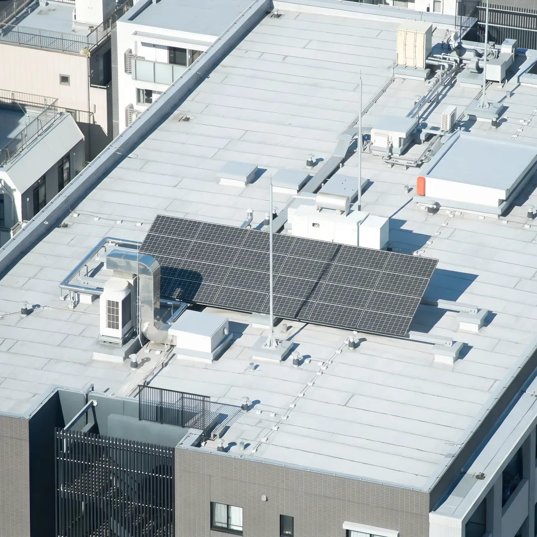 Commercial roofer repairing a flat roof