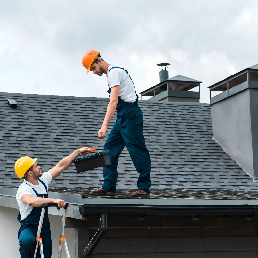 Roofer installing storm-resistant shingles