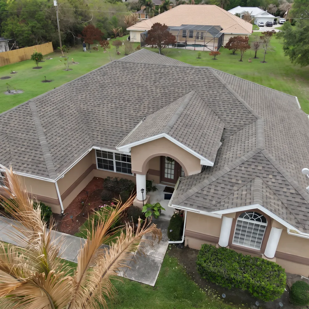 Roofing specialist inspecting a South Florida roof