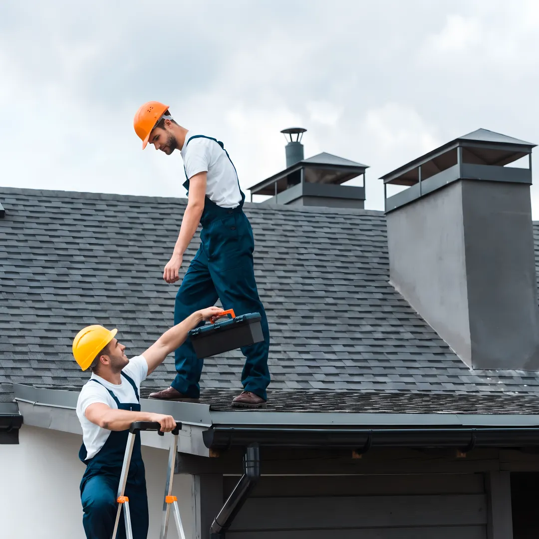 Roofers installing storm-resistant shingles on a Florida home