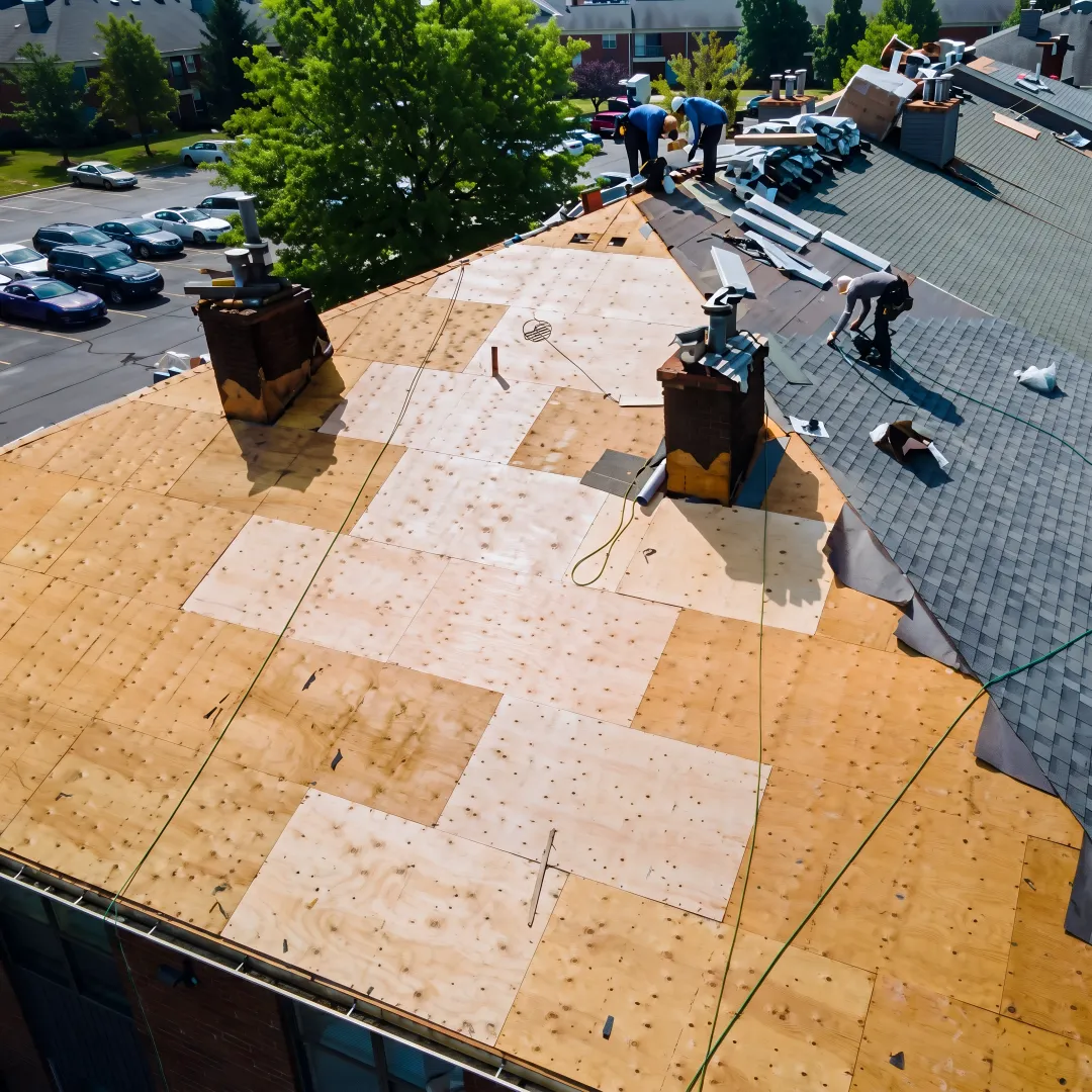 Roofer installing shingles on a Florida home