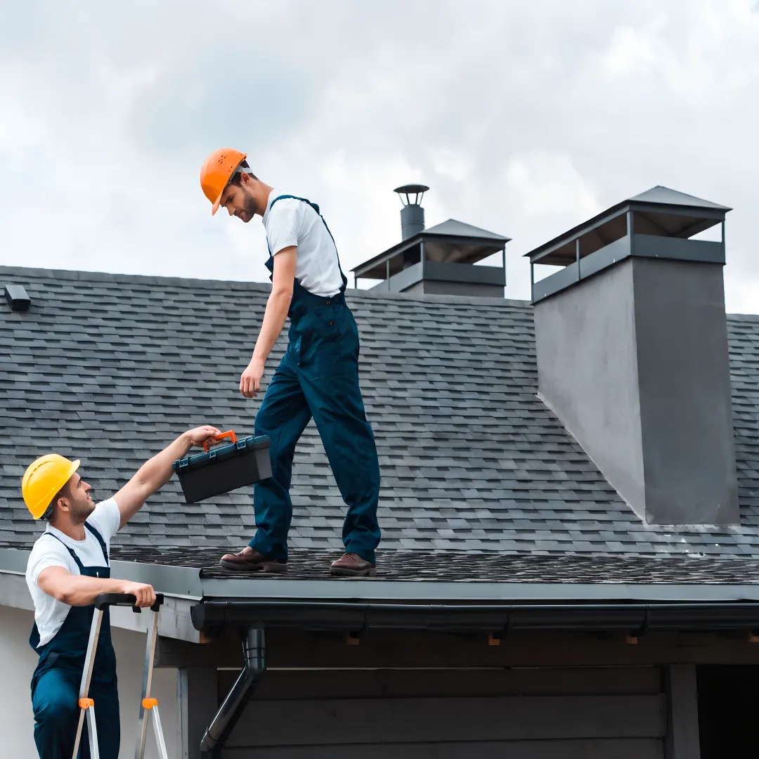 Roofers installing shingles on a Florida home