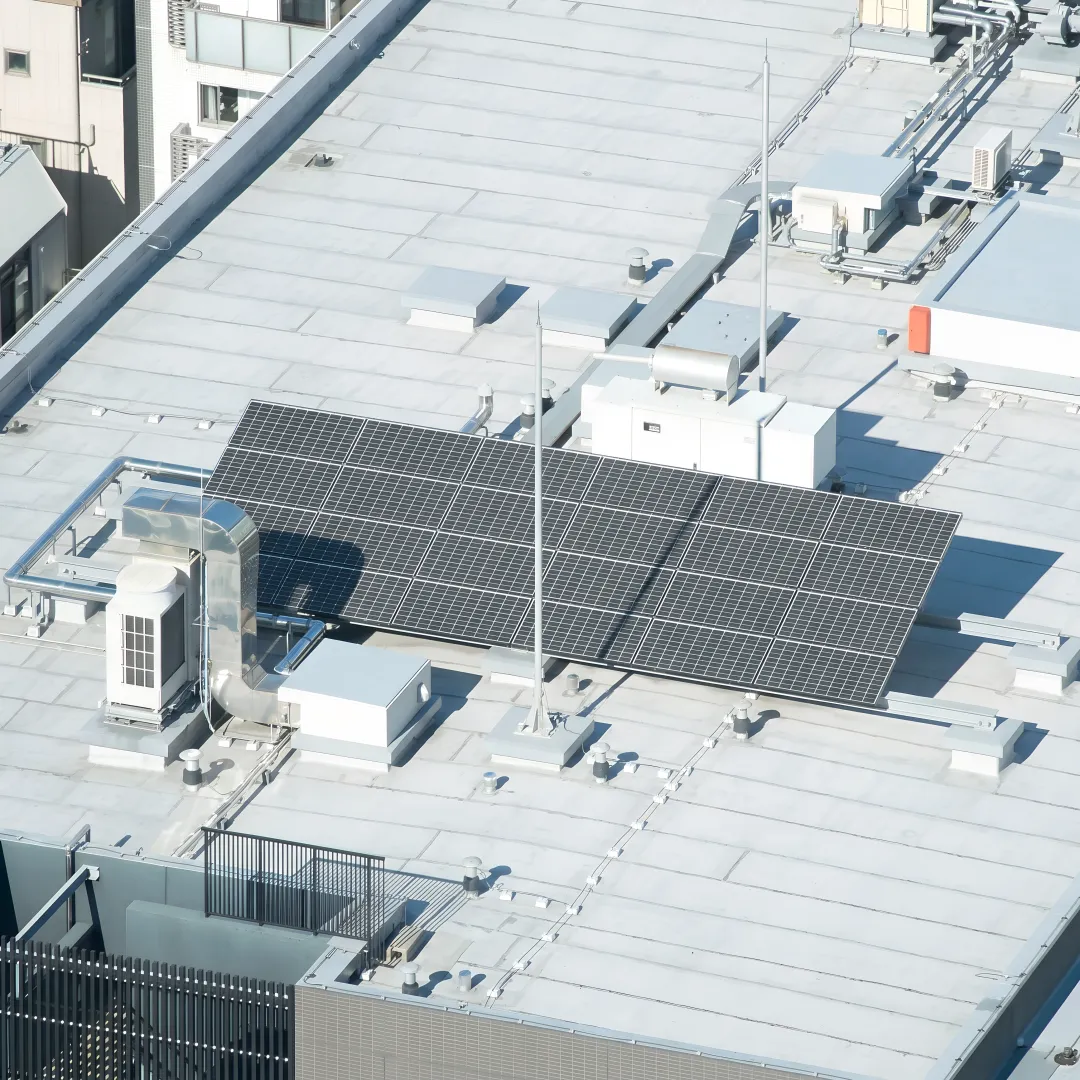 Technician evaluating a commercial roof