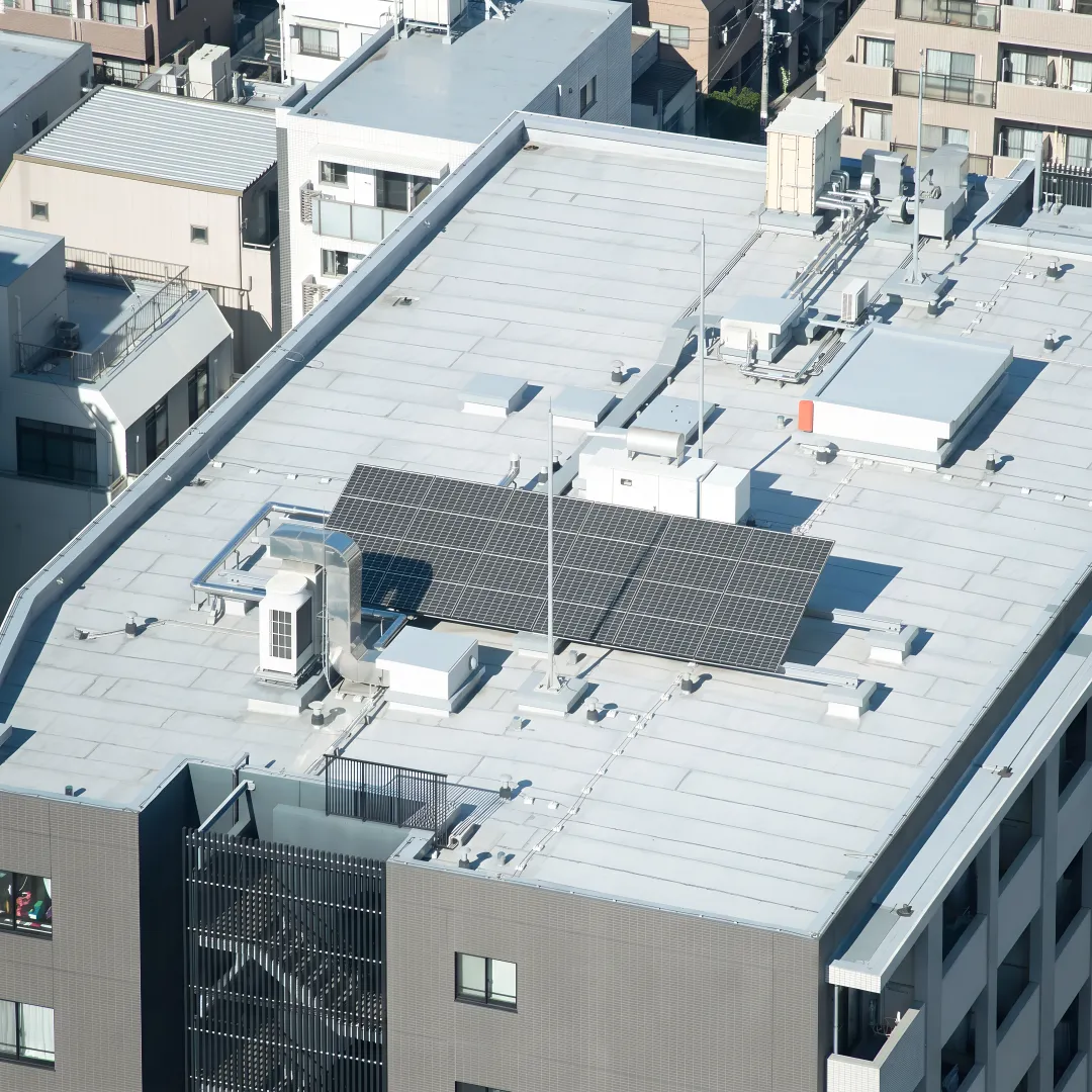 Commercial roofing crew installing roof system