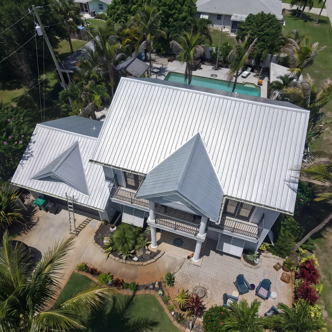 Sealed metal roof surface with reflective finish