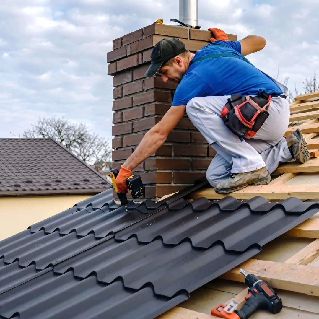 Roofing professionals installing metal panels