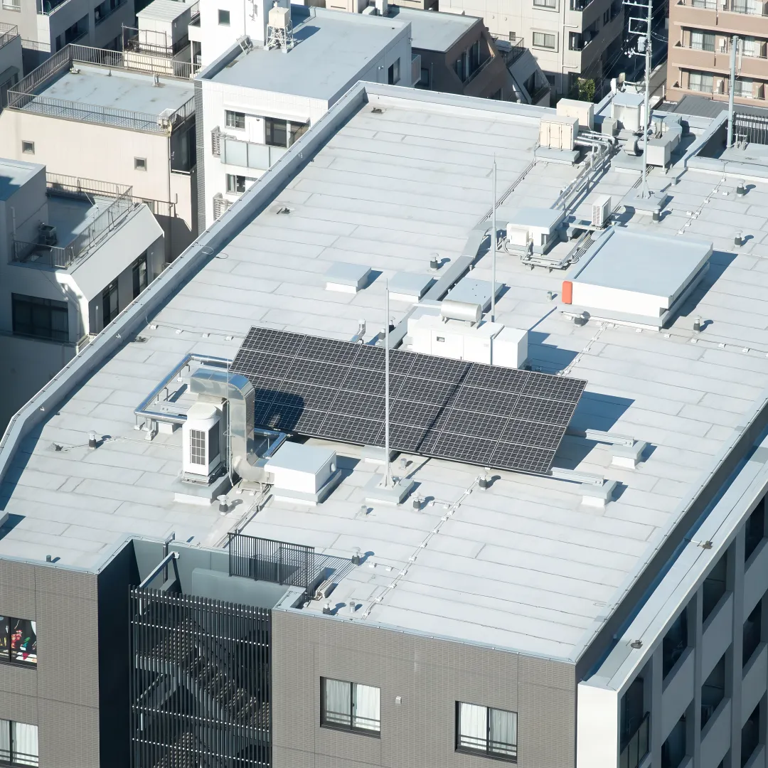 Roofing crew installing a flat roof