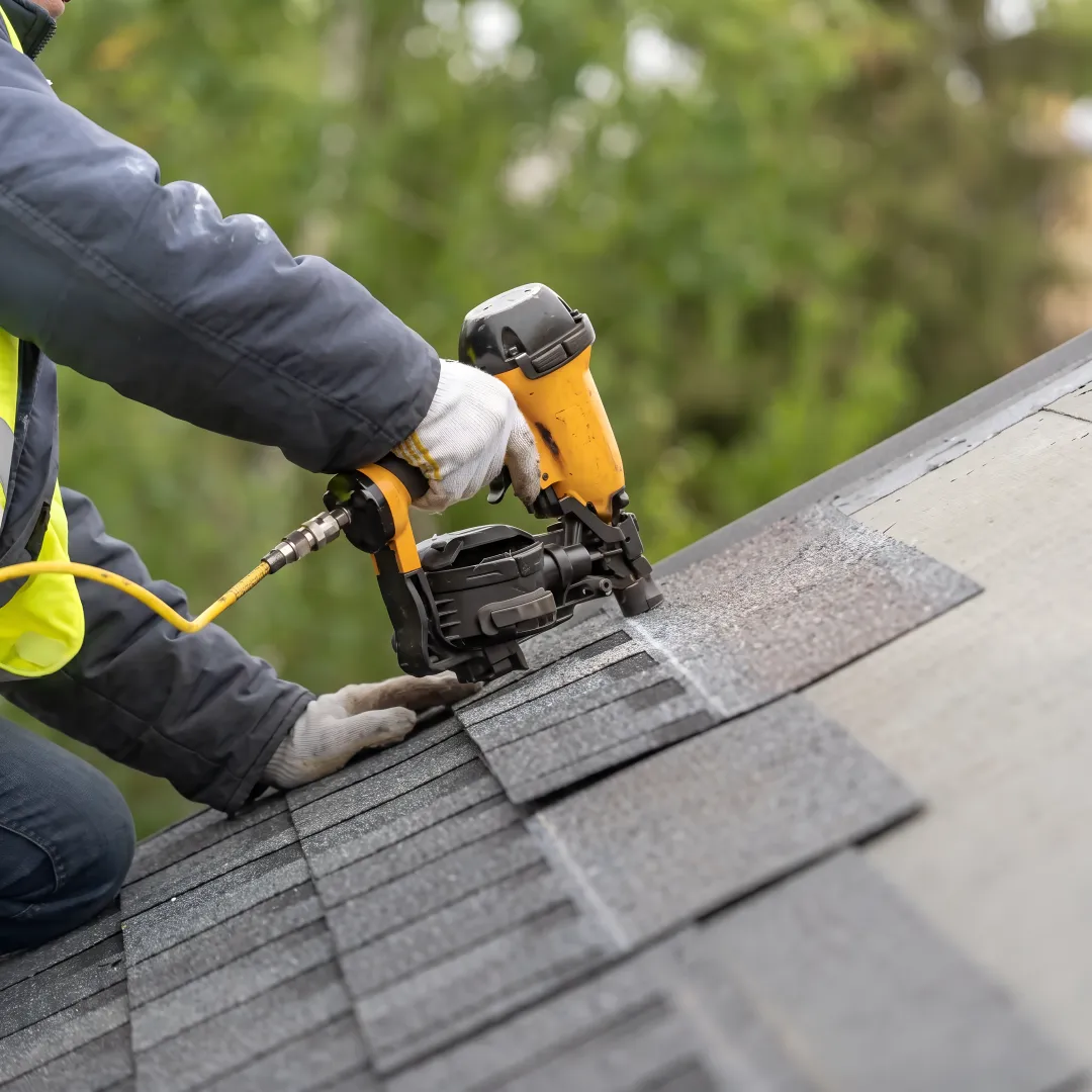 Roofers installing architectural shingles