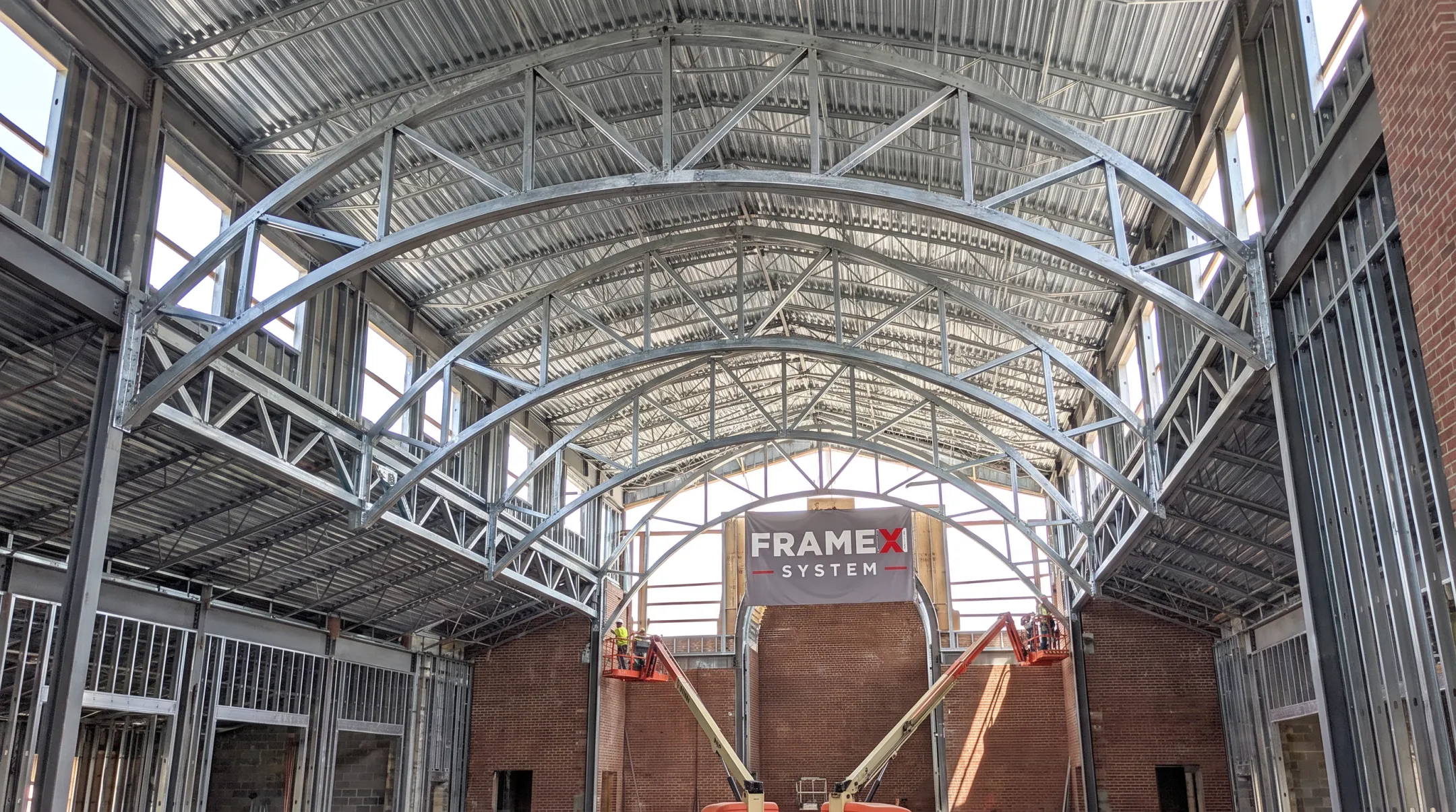 Cold-formed steel curved trusses vaulted ceiling church installation