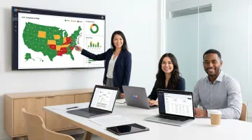 Fintech embedded finance team reviewing multi-state licensing obligations on laptop screens
