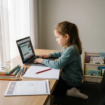 Young child learning with an online tutor