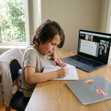 Primary school student learning writing online