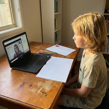 Child learning with online tutoring at home