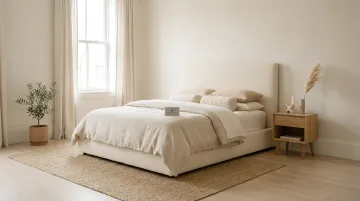 Serene natural bedroom interior with linen bedding light wood and jute rug