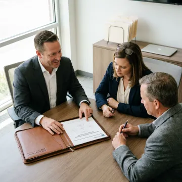 Advisor discussing business protection planning with owners