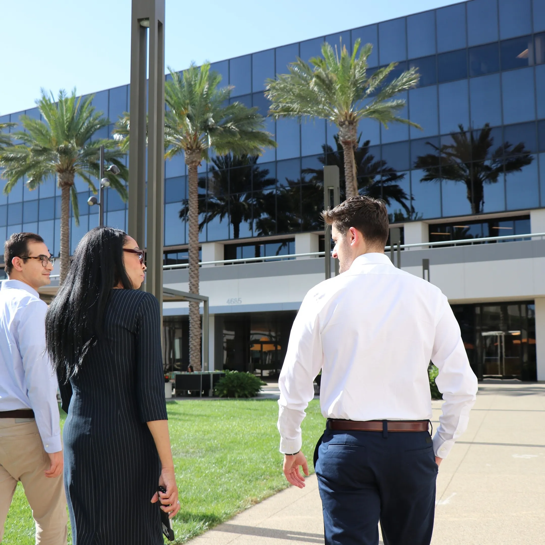 Strategic communications team reviewing a solar company report