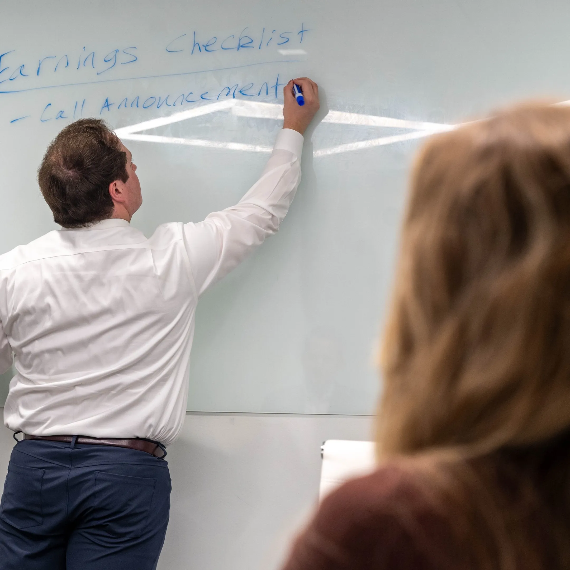 Advisor discussing corporate communications strategy with executives