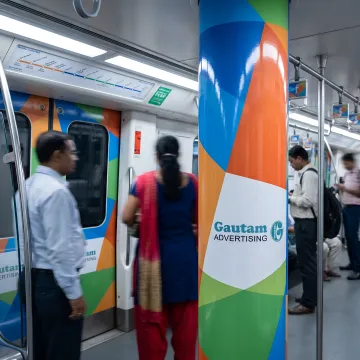 Metro train interior with branded advertising wrap
