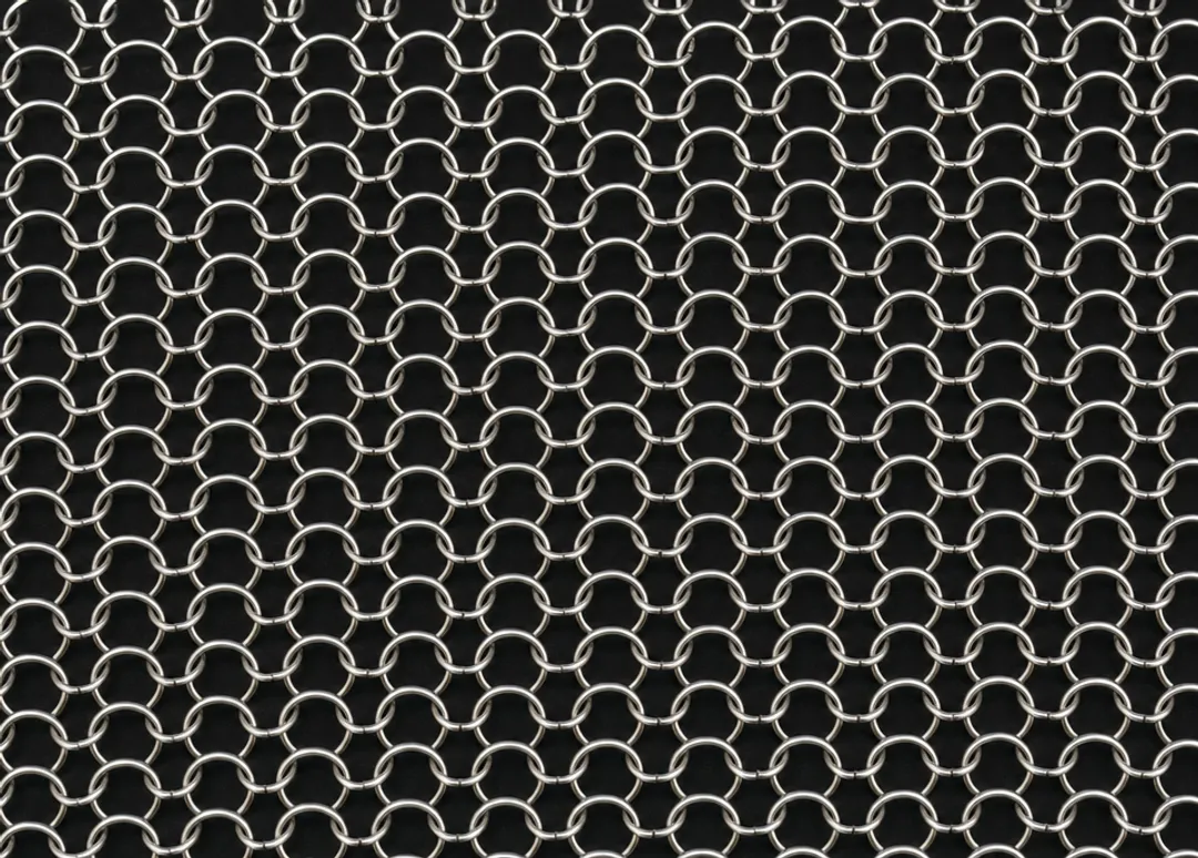 Stainless steel knitted wire mesh roll showing fine wire loop texture