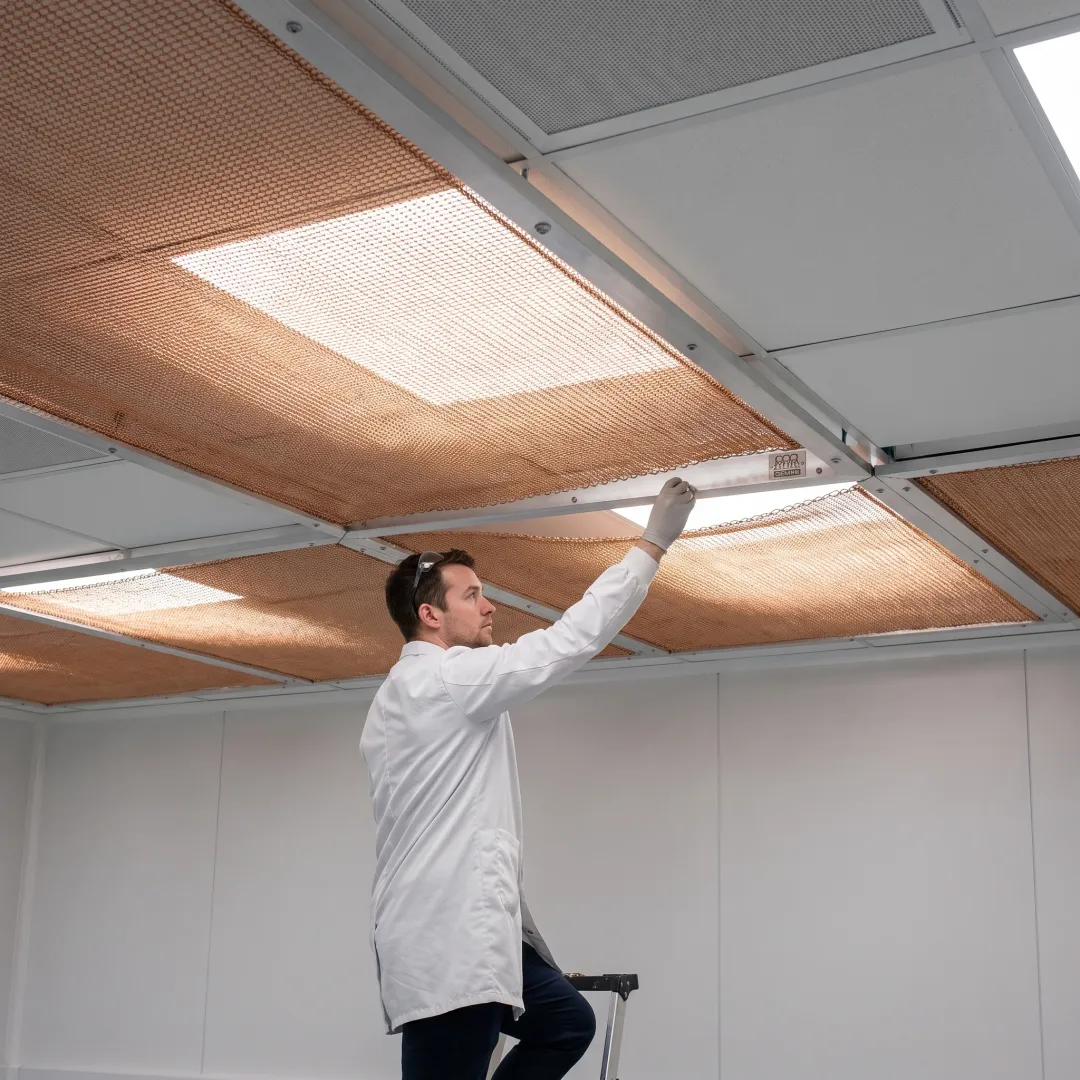 Laboratory with copper mesh ceiling installation