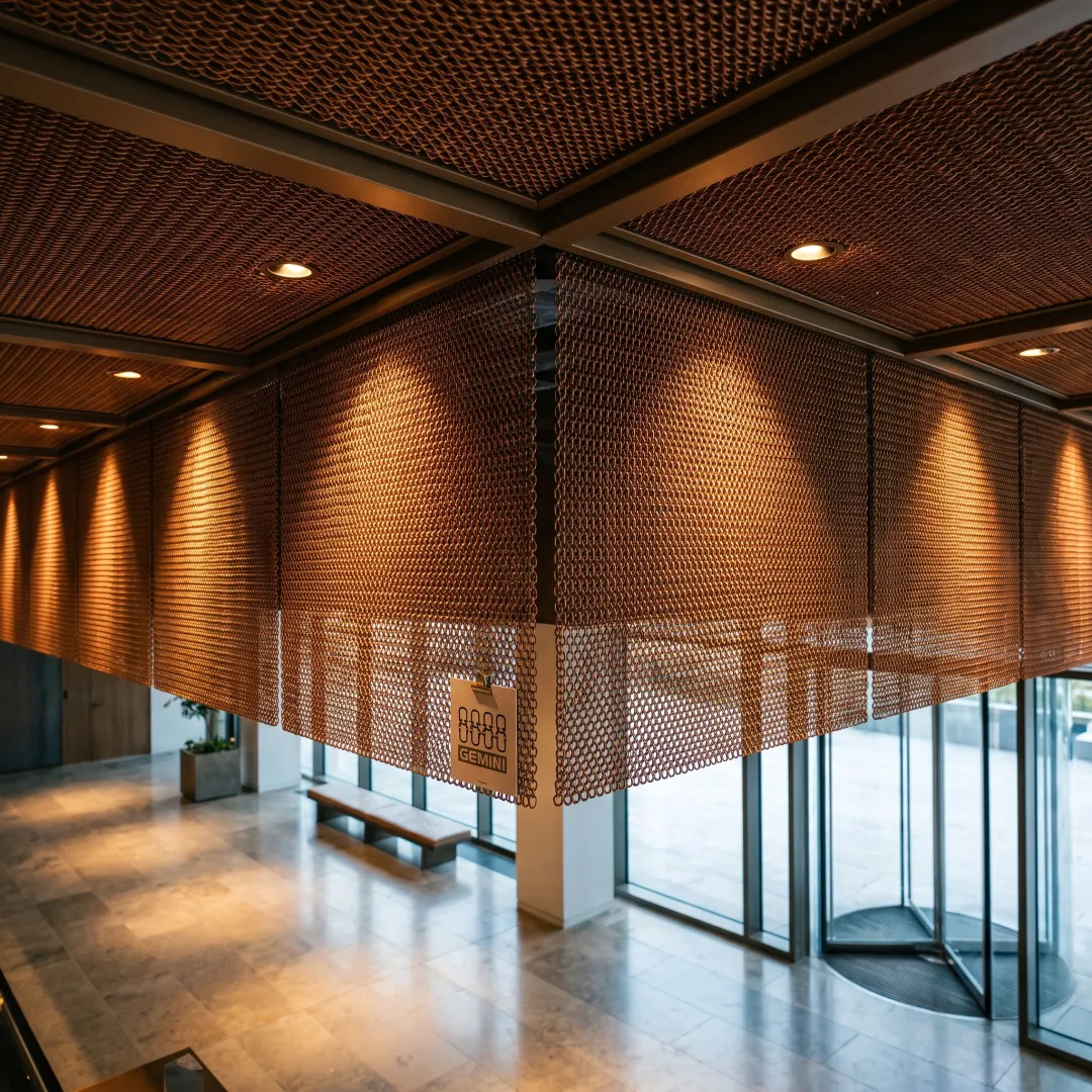 Architectural interior with copper mesh ceiling tiles