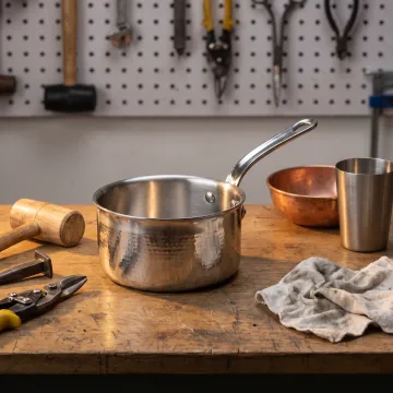 Handcrafted premium saucepan on a kitchen workbench