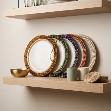Beaded charger plates displayed in boutique retail store