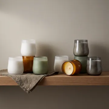 Home decor glass candle vessels on display shelf