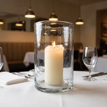 Hurricane vase used in restaurant table setting