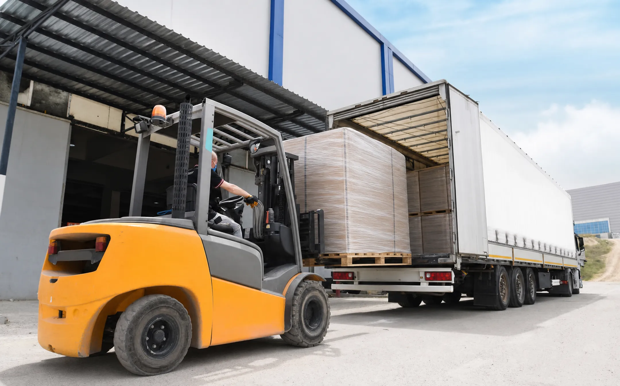 Freight pallet loaded onto truck for LTL shipping delivery