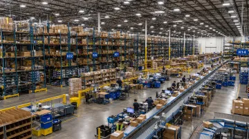 Modern warehouse facility with inventory shelving systems and fulfillment operations in progress