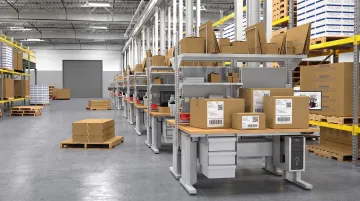 Warehouse shipping station with multiple labeled packages grouped together for multi-piece shipment
