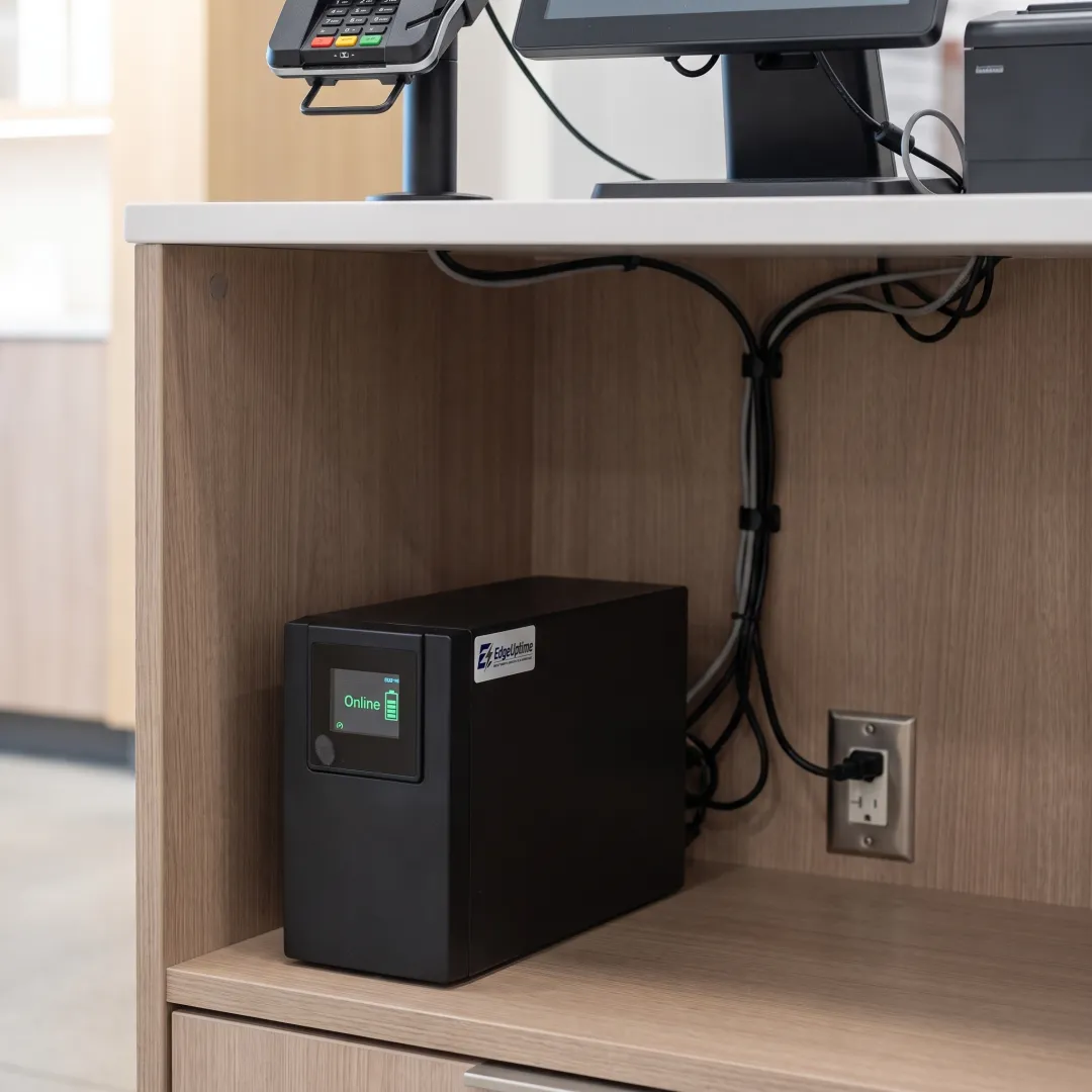 Retail store checkout with POS terminal protected by a UPS