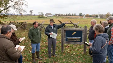 Executives on immersive Gettysburg battlefield leadership training tour with faculty