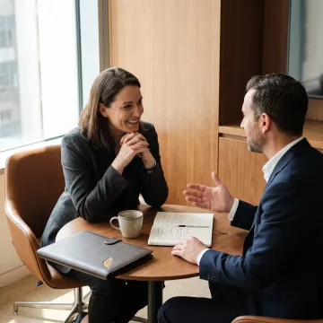 Two leaders having a focused workplace conversation