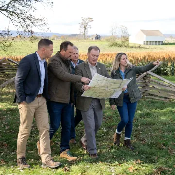 Executive leaders participating in an immersive battlefield leadership program