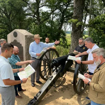 Executives participating in an outdoor leadership exercise