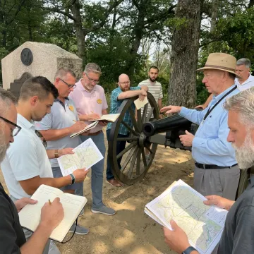 Corporate leaders participating in experiential team leadership training