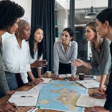 Women leaders collaborating during an immersive leadership workshop