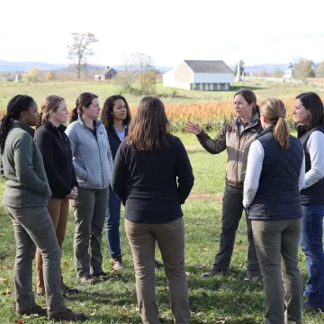 Women leaders collaborating during an outdoor leadership retreat