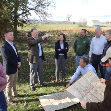 Executives participating in an outdoor leadership discussion
