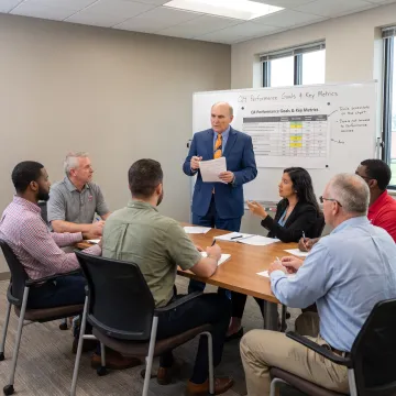 Supervisor leading a performance discussion with team members